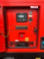 Close-up of the generator control panel behind an open access door.