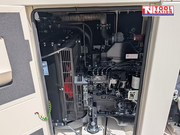 Rear view of the generator with both rear access doors open, showing internal engine and alternator components.