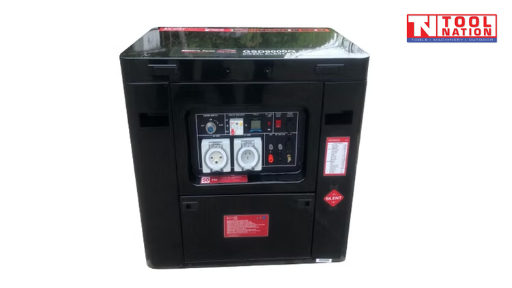 Front view of red enclosed diesel generator with control panel, power outlets, warning labels and black base frame.