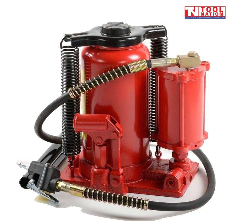 Close-up of red air hydraulic bottle jack with black hose, metal connector, and twin return springs