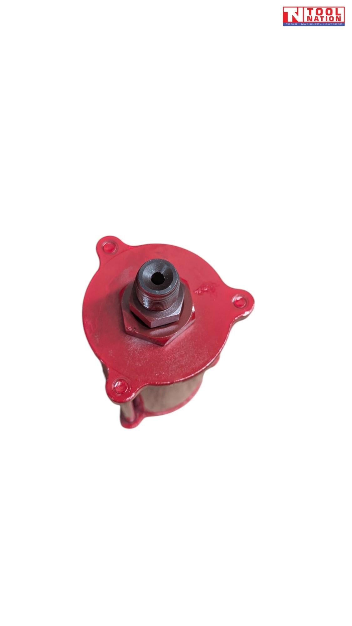 Close-up of red hydraulic jack pump component with threaded outlet fitting viewed from above