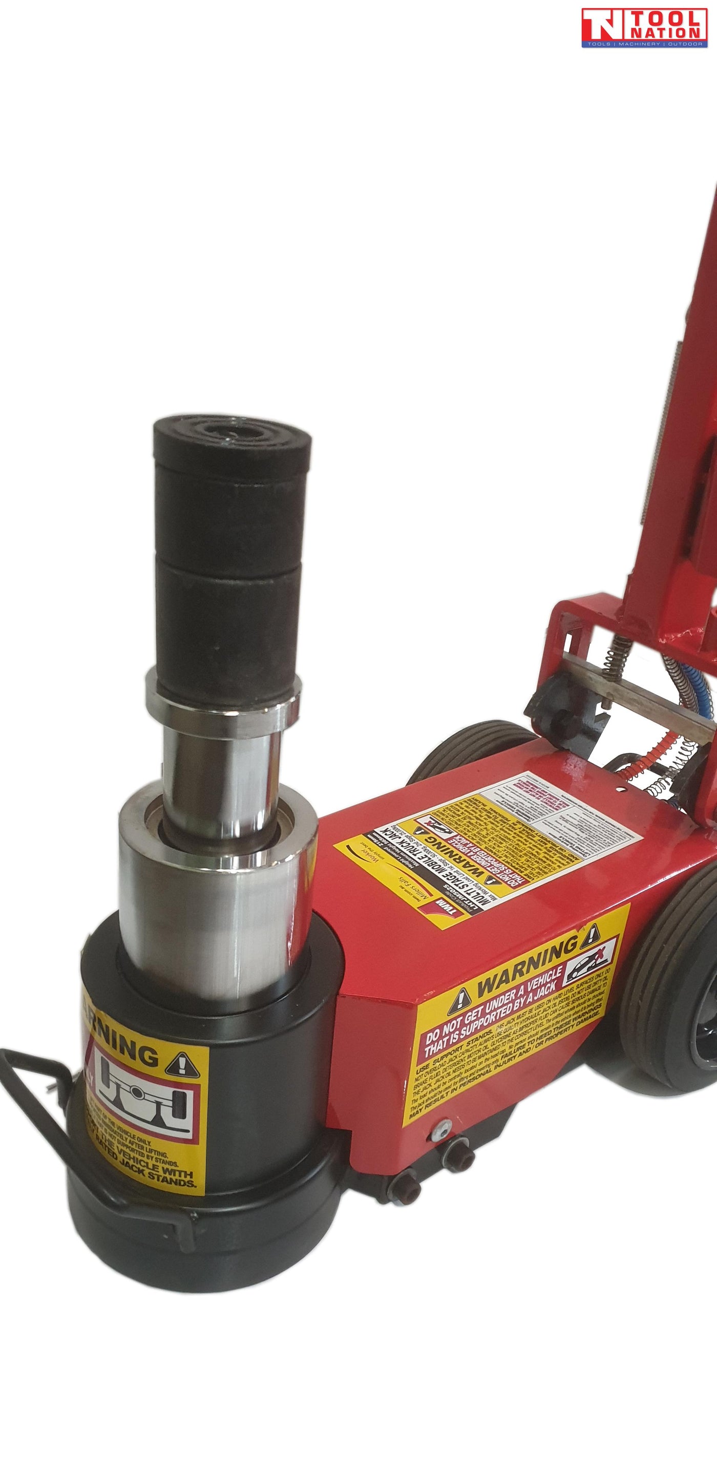 Close-up of extended short body truck jack piston and black extension adaptor