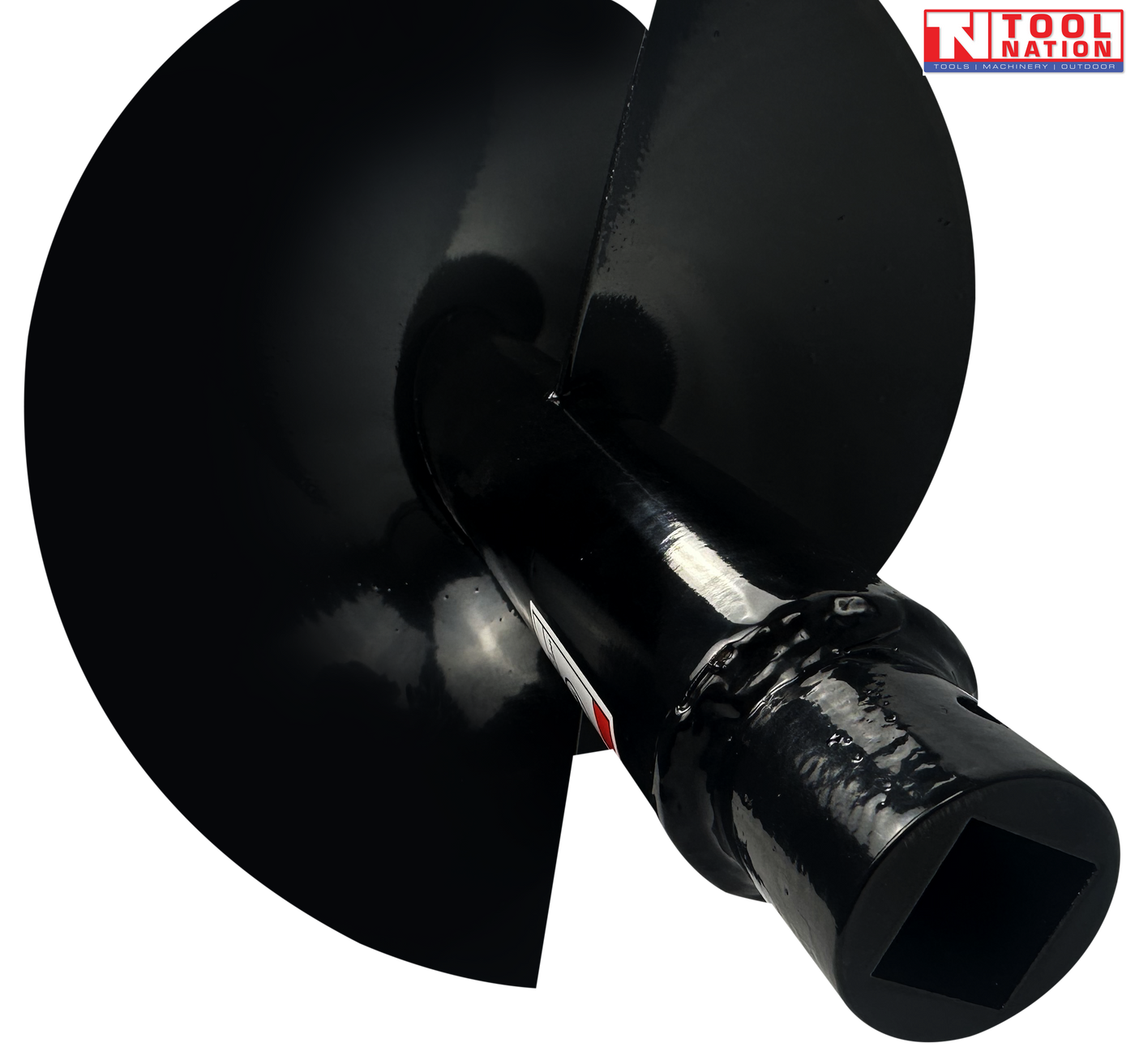 Close-up of a black auger bit showing spiral flighting, warning label, and square drive end.