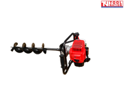 Side view of a petrol earth auger with white fuel tank, black trigger handle, red engine cover, and attached spiral auger bit.