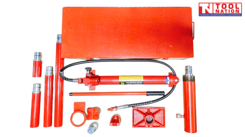 Red steel case with hydraulic repair kit components laid out, including pump, hose, ram, handle, extensions, and attachments