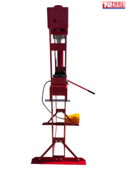 Narrow side view of the red shop press showing the frame depth, pressing head, red handle, black hose, and yellow foot pedal.