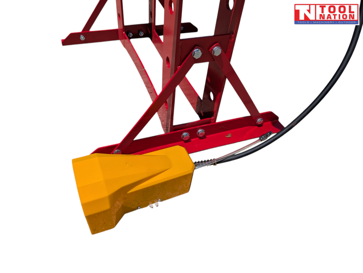 Close-up of a yellow foot pedal attached near the base of the red shop press frame.