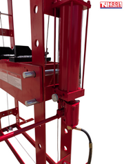 Close-up of red side hydraulic cylinder, handle, adjustment knob, and hose connection