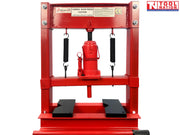 Front view of red shop press with bottle jack, return springs, press plates, and handle