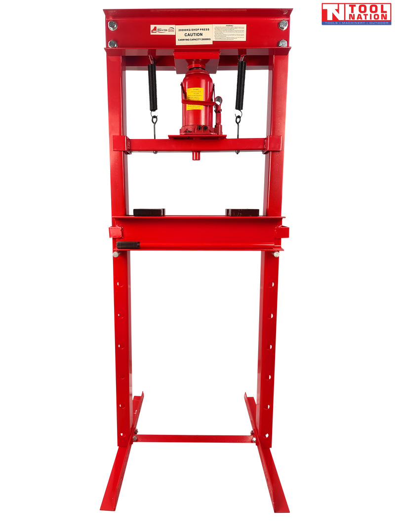 Front view of red shop press with bottle jack, return springs, press plates, and handle on black background