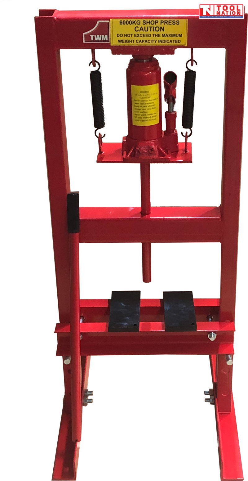 Front view of red shop press with bottle jack, return springs, press plates, and handle on black background