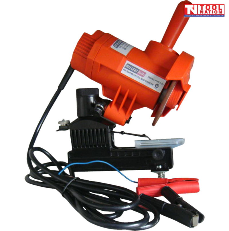 Orange chain sharpener with black base, grinding wheel, handle, clamp, cables, red and black battery clips, and logo in the top corner.