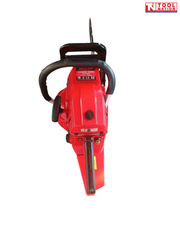 Top view of a red chainsaw showing the front handle, rear handle, top housing and a partly visible guide bar.
