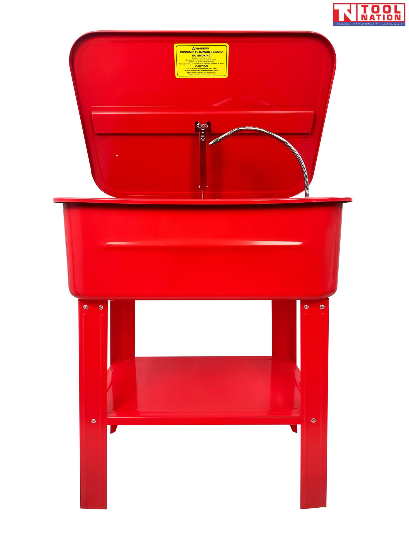 Red parts washer interior view with lid open, flexible hose, removable tray, and yellow warning label