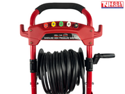 Close-up of a red pressure washer handle with nozzle holders, coiled hose reel, crank handle, and a logo in the top right corner.