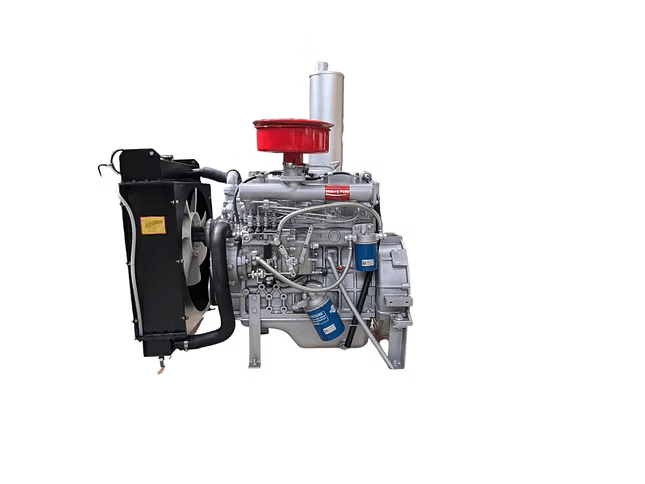 Silver diesel engine shown from the side with a black radiator, red air filter, vertical silver exhaust, blue filters and hoses visible.