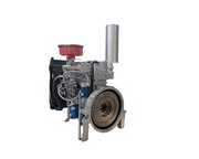 Silver diesel engine shown from the flywheel side with a red air filter, vertical silver exhaust, blue filters, hoses and black radiator visible.