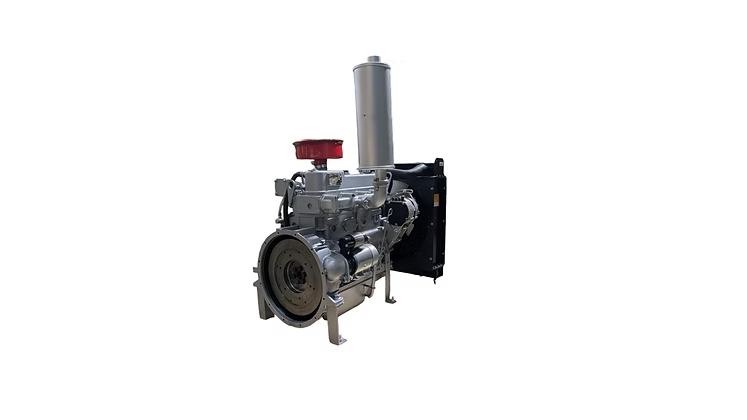 Silver diesel engine shown from the flywheel side with a red air filter, vertical silver exhaust, black radiator and metal frame supports visible.