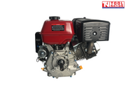 Red, black and silver petrol engine shown from the shaft side with red fuel tank, output shaft, black exhaust cover and Tool Nation logo.