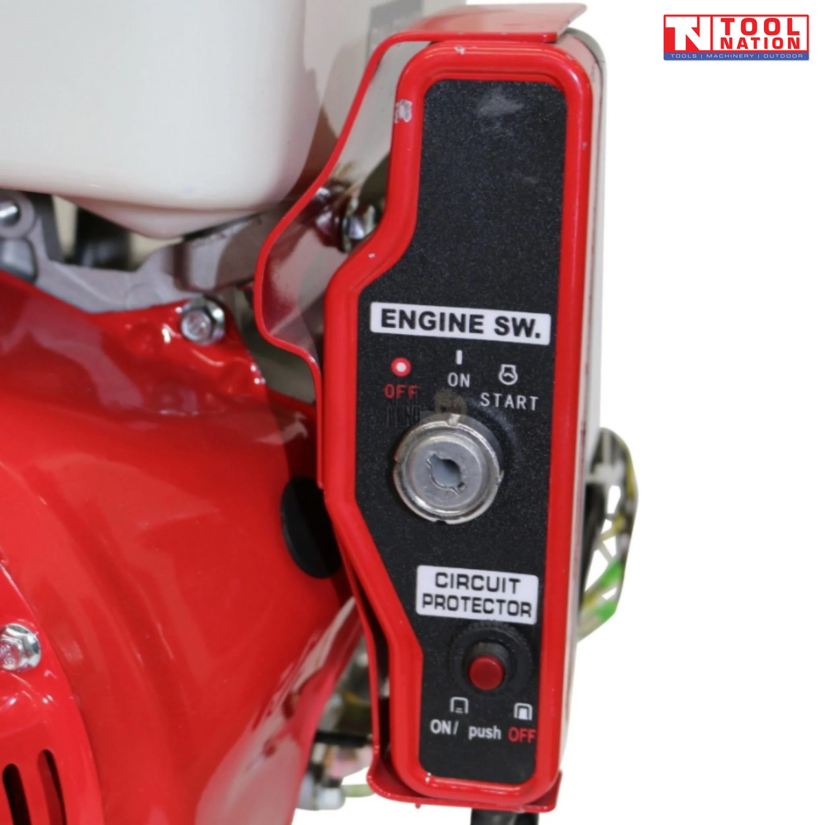 Close-up of a red engine switch panel showing key switch, circuit protector button and printed on, off and start labels.