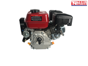 Red and silver petrol engine shown from the shaft side with red fuel tank, output shaft, black exhaust cover, black air filter cover and Tool Nation logo.