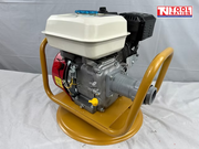 Petrol engine mounted in a yellow cradle with white fuel tank, black air filter cover, grey coupling, and logo in the top corner.
