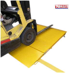 Forklift positioned on a yellow loading ramp with textured deck plate, front flap, handle and Tool Nation logo.