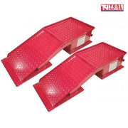 Pair of red steel vehicle ramps with diamond plate surfaces, base plates, side labels and Tool Nation logo.