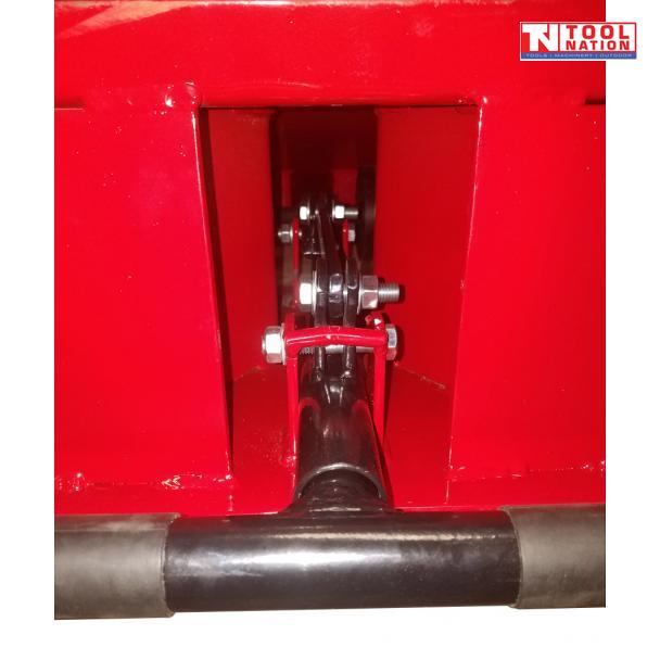 Close-up of a red vehicle ramp showing the black T-handle connection, metal linkage, bolts and Tool Nation logo.