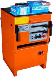 Orange bench-mounted rebar bender and cutter with front controls, side handles, blue foot switch boxes on top, labels, and logo in the top corner.