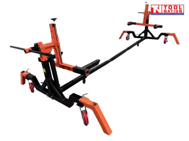 Angled view of black and orange car rotisserie with extended center beam and castor wheels