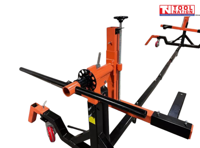 Close-up of rotisserie head assembly with black handle, orange frame, and support arms