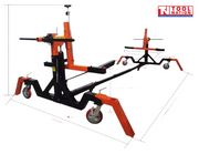 Orange and black vehicle rotisserie frame shown with dimension guide lines, caster wheels, and a logo in the top right corner.