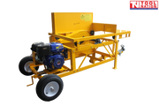 Yellow towable saw bench shown at an angle with a blue and black engine, large frame, cutting table, tow hitch, wheel and Tool Nation logo.