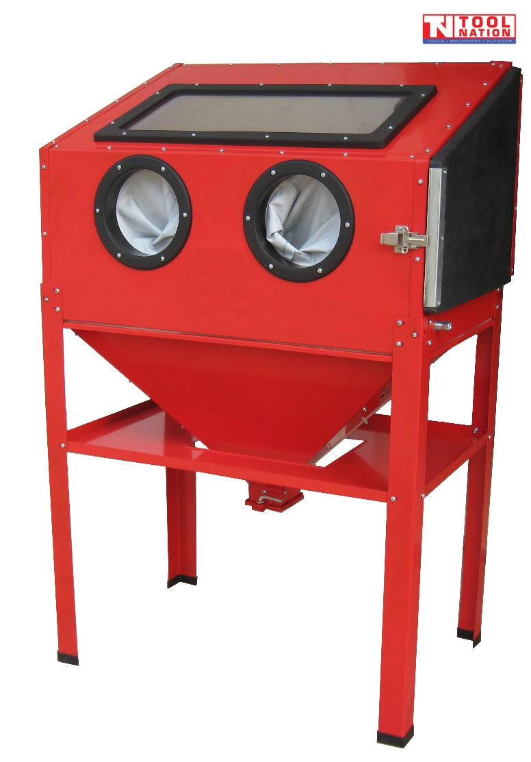 Front angled view of a red sandblasting cabinet with top viewing window, two front glove ports and a closed side access door.