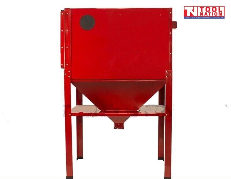 Rear view of a red sandblasting cabinet on four legs, showing the back panel and lower funnel hopper.