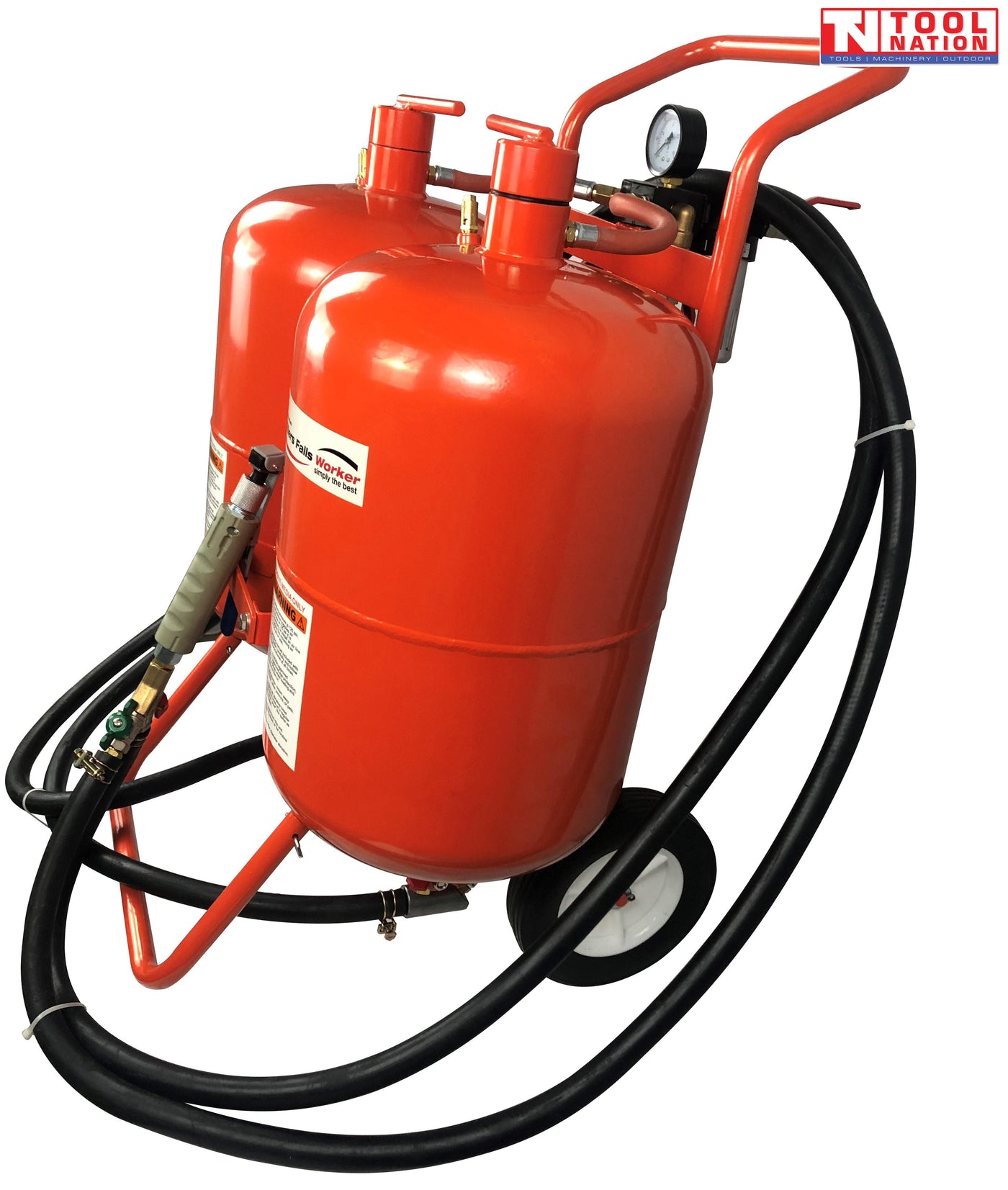 Angled view of the twin-tank blasting unit showing the two red tanks, wheeled frame, spray handle, pressure gauge and long black hoses wrapped around the frame.