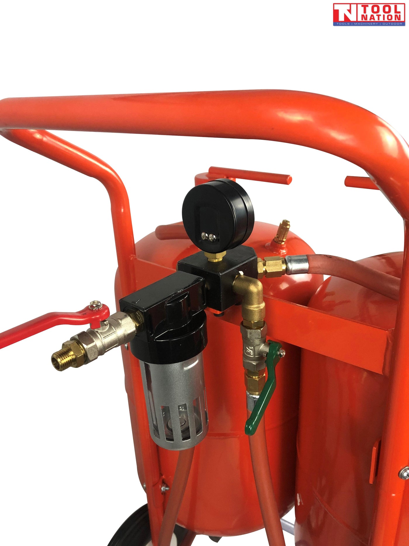 Close-up of the regulator and gauge assembly mounted above the tanks, with hoses and valve controls attached to the frame.