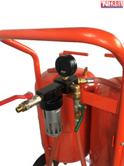 Close-up of the regulator and gauge assembly mounted above the tanks, with hoses and valve controls attached to the frame.