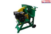 Green and yellow log saw with a black engine, large circular blade guard, cutting cradle, two wheels and Tool Nation logo.