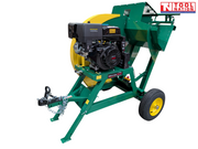 Green and yellow towable saw bench shown at an angle with a black engine, blade guard, cutting cradle, tow hitch, chain, wheel and Tool Nation logo.