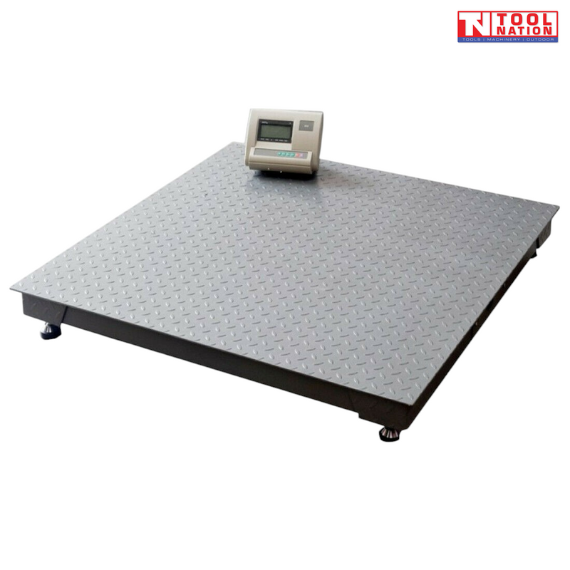Low-profile platform scale with a textured surface and digital readout on top.