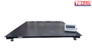 Low-profile platform scale with a textured surface and digital readout on top.