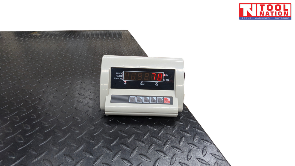 Digital scale readout sitting on a textured platform surface.