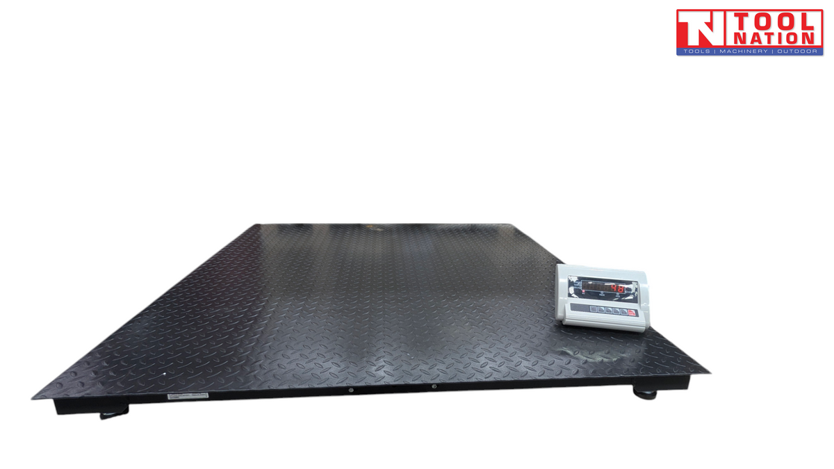 Low-profile platform scale with a textured surface and digital readout on top.