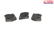Three dark metal cutter teeth with two mounting holes each and worn cutting tips on a white background.