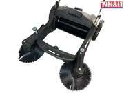 Underside view of a grey and black manual sweeper showing two round side brushes, central brush roller, wheels and handle rods.