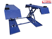 Front view of a blue mid-rise car lift with both diamond-plate end ramps folded up, black rubber blocks on the platforms, and a light grey background.