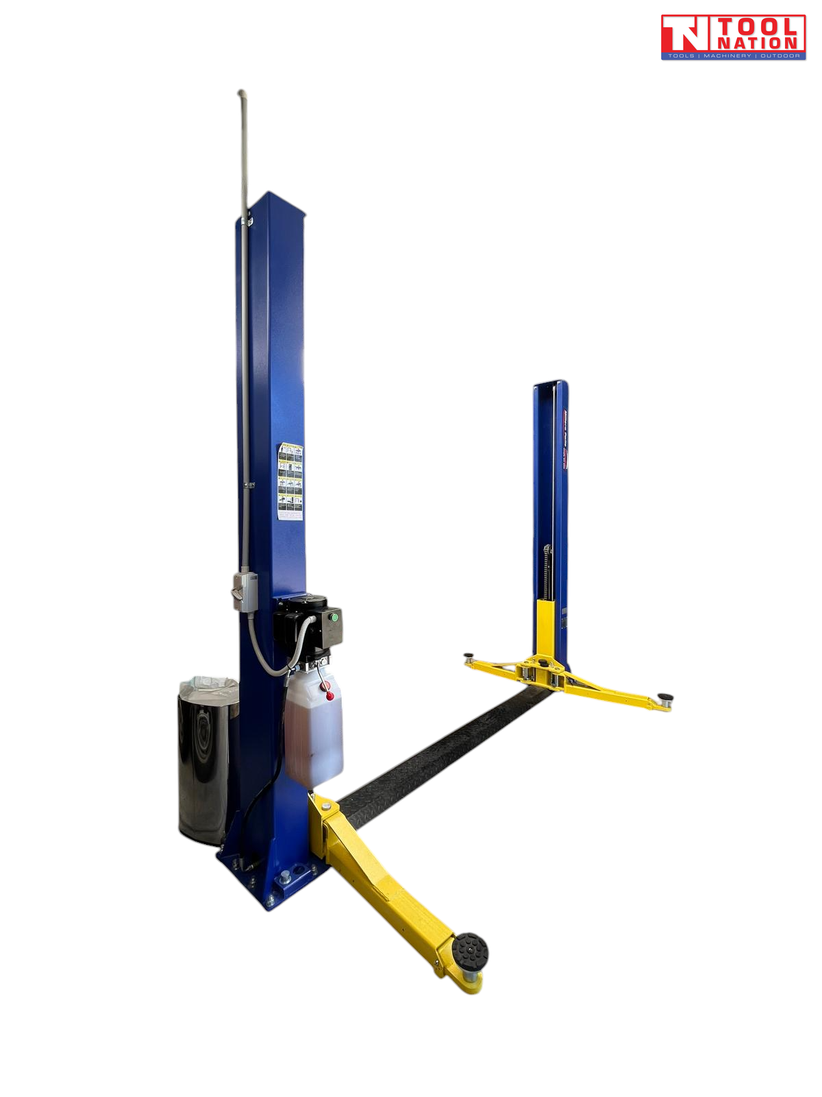 Front view of a blue two-post vehicle lift with yellow lifting arms, a black floor plate between the posts, and a motor and fluid reservoir mounted on the left post.