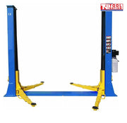 Angled view of a blue two-post vehicle lift with yellow lifting arms and a black floor plate between the posts on a light grey background.